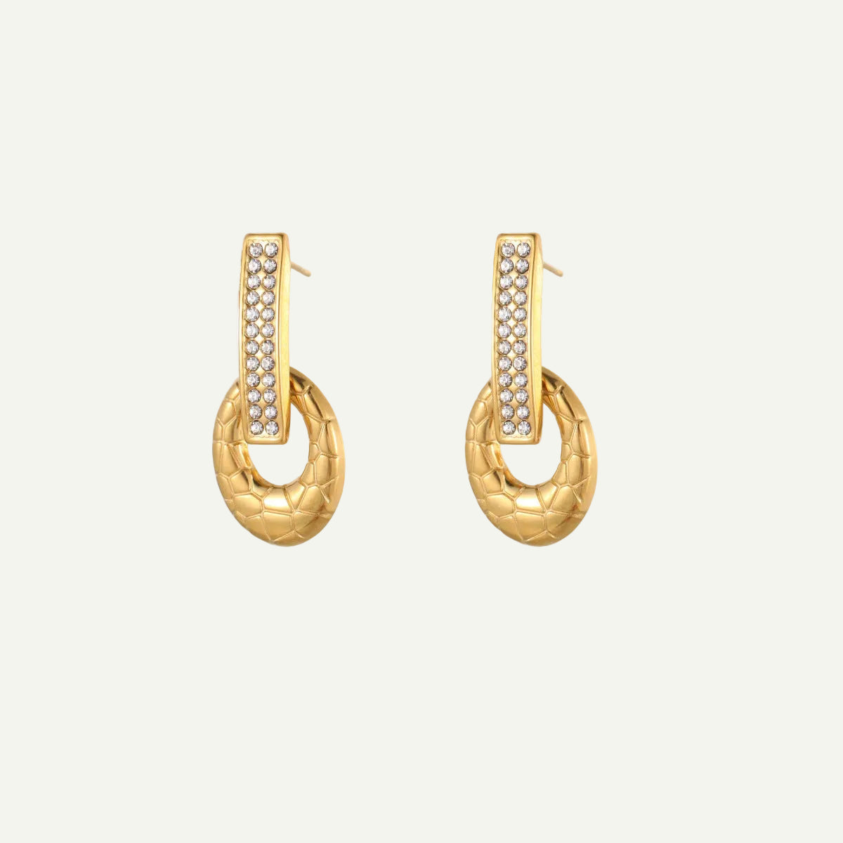 Gold hoop earrings with embedded stones on a white background